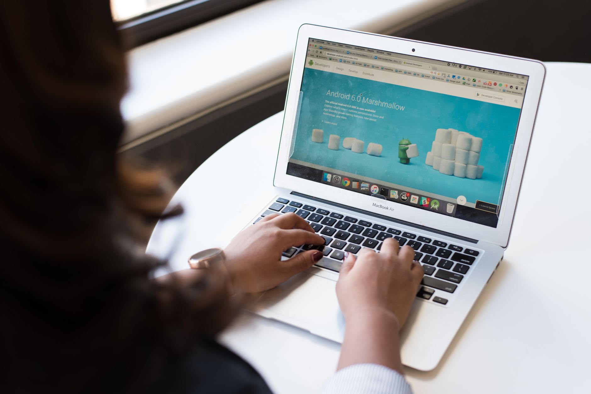 A laptop on a desk showing a finished website layout