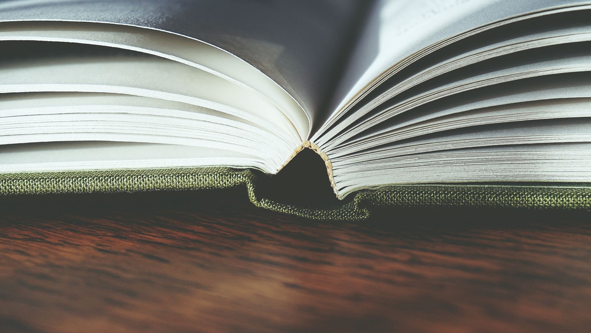 Printed case study pages with product photos spread on a table