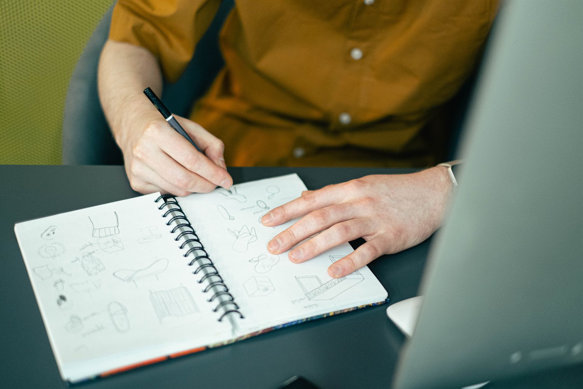 An open notebook with a hand-drawn project timeline