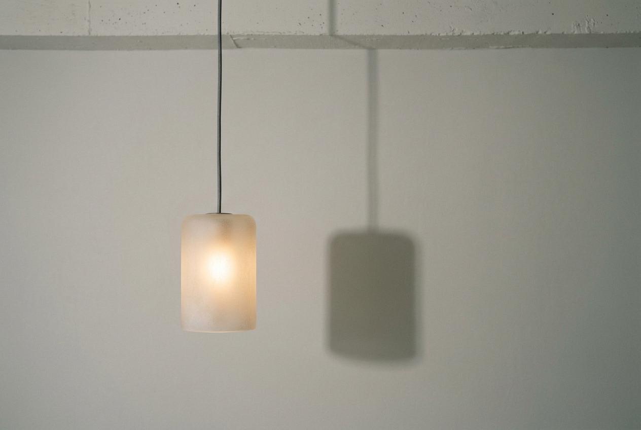 Frosted glass pendant on a studio set