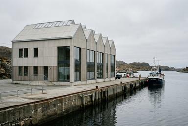 Studio building with a sawtooth roof by the harbour