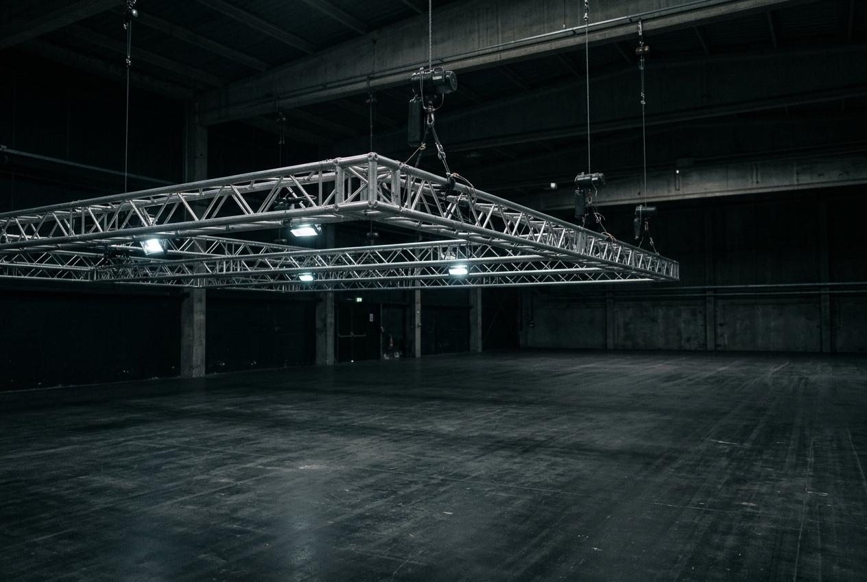 Truss grid above an empty venue floor